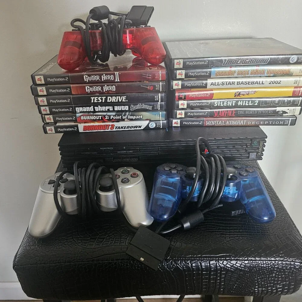 Playsation 2 (PS2 Fat) with controllers and games and PS2 Slim